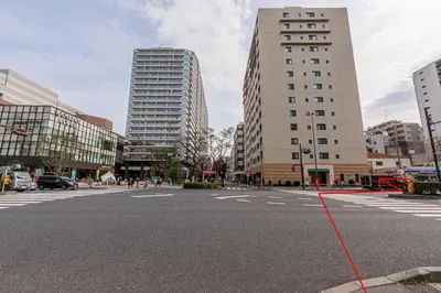a city street with a red rope across a street at KYARA HOTEL\u3000\u4e80\u6238502 in Tokyo