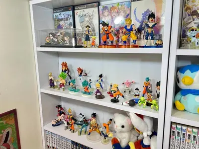 a shelf filled with figurines and other toys at Shobi Building 2 208 - Vacation STAY 16685 in Tokyo