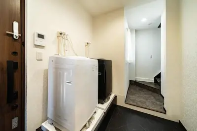 a bathroom with a refrigerator and a mirror at 84-5, Shiomi 301, Entire room for rent, \u6f6e\u898bB301 in Tokyo