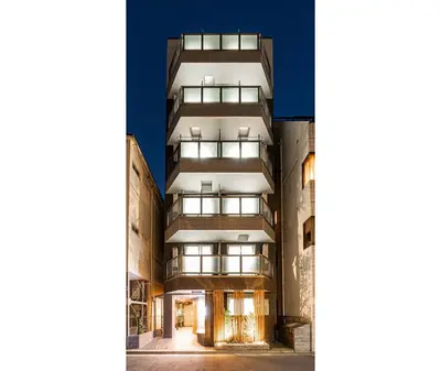 an image of an apartment building with lights on at Six7 Asakusa Ryogoku in Tokyo