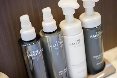 a group of three shampoo bottles sitting on a shelf at Anshin oyado Tokyo Man Shinjuku in Tokyo