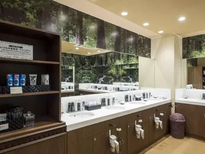 a bathroom with three sinks and a large window at Anshin oyado Tokyo Man Shinjuku in Tokyo