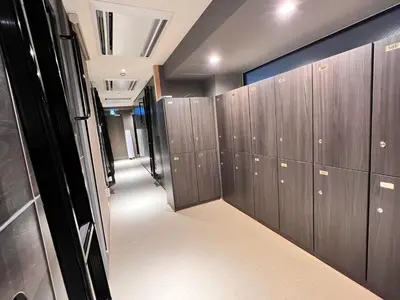 a row of lockers in a locker room at Capsule Hotel Suzumoriya in Tokyo