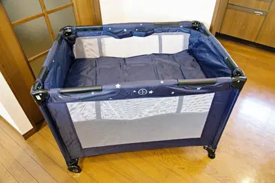 an open suitcase is sitting on a wooden floor at NH Buil 7F in Tokyo