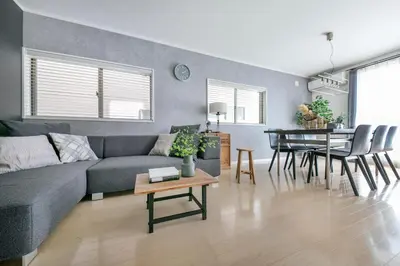 a living room with a couch and a table at \u3077\u3075\u304b\u5927\u5cf6 in Tokyo
