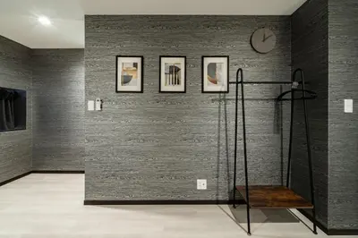 a room with a shower and a clock on a wall at 90, Yotsugi-A, private house rental, \u30ef\u30f3\u30d3\u30ec\u30c3\u30b8\u56db\u3064\u6728 in Tokyo