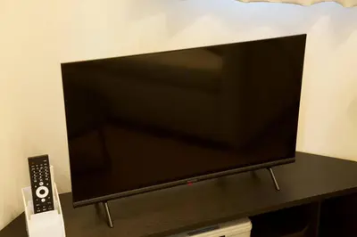a flat screen tv sitting on a table at \u30ea\u30de\u30fc\u30eb\u30d3\u30eb2 401 in Tokyo