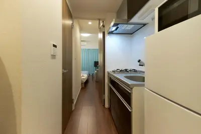 a small bathroom with a sink and a toilet at G-Stage 01 IKEBUKURO by Tranova in Tokyo