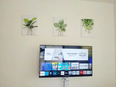 a flat screen tv hanging on a wall at MEZON DE OAK Shin-Okubo in Tokyo
