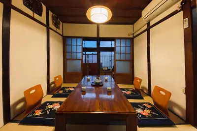 a dining room with a wooden table and chairs at Konoha House - Vacation STAY 11581v in Tokyo