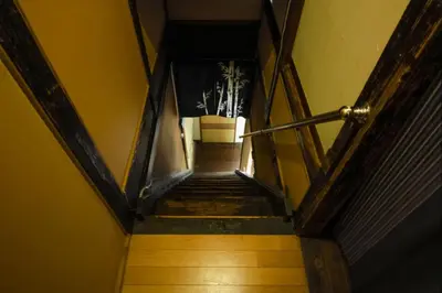 a flight of stairs with a plant in a box at Konoha House - Vacation STAY 11581v in Tokyo