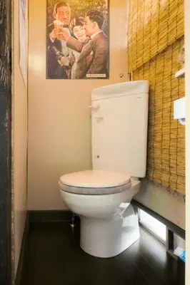a bathroom with a toilet with a picture on the wall at Konoha House - Vacation STAY 11581v in Tokyo