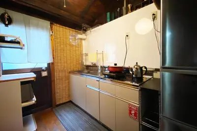 a small kitchen with a stove and a refrigerator at Konoha House - Vacation STAY 11581v in Tokyo
