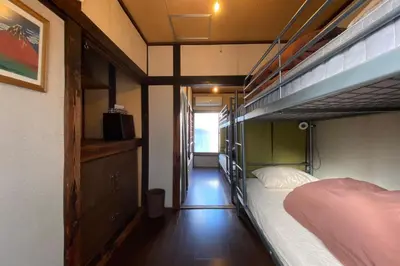 a bedroom with two bunk beds and a hallway at Konoha House - Vacation STAY 11581v in Tokyo
