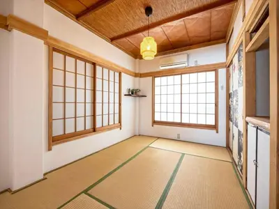an empty room with windows and a large room with aamed ceilings at Eden House - Vacation STAY 16713 in Tokyo