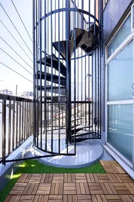 a spiral staircase on the balcony of a building at Eden House - Vacation STAY 16713 in Tokyo