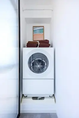 a washer and dryer in a room with a wall at Eden House - Vacation STAY 16713 in Tokyo