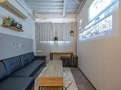 a living room with a couch and a table at Eden House - Vacation STAY 16712 in Tokyo