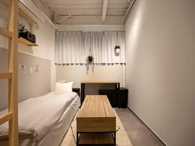 a small room with a bed and a table at Eden House - Vacation STAY 16712 in Tokyo