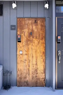 a wooden door on the side of a building at Eden House - Vacation STAY 16712 in Tokyo