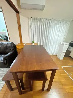 a wooden table in the middle of a living room at 3 bedrooms entire house in Tokyo