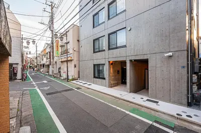 an empty street in a city with buildings at 67 Apt \u677f\u6a4b\u672c\u753a in Tokyo