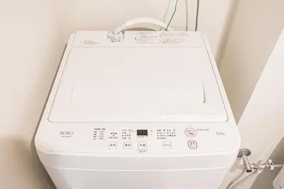 a washer and dryer in a room at 67 Apt \u677f\u6a4b\u672c\u753a in Tokyo