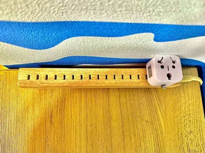a ruler sitting on top of a wooden drawer at Hokusai's House Shibuya Dogenzaka 311 in Tokyo