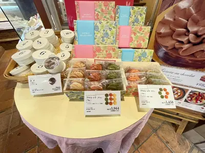 a table with different types of donuts and other pastries at \u6771\u7530\u7aef2F-kKI0064 in Tokyo