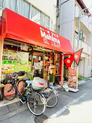 a bike parked in front of a shop with a red awning at \u6771\u7530\u7aef2F-kKI0064 in Tokyo