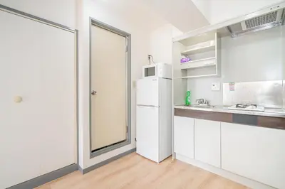 a kitchen with white cabinets and a white refrigerator at Shinjuku Takadanobaba 6 mins walk 2BR Room201 in Tokyo
