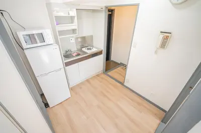 a kitchen with a refrigerator and a microwave at Shinjuku Takadanobaba 6 mins walk 2BR Room201 in Tokyo