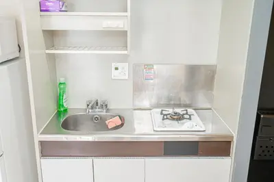 a small kitchen with a sink and a stove at Shinjuku Takadanobaba 6 mins walk 2BR Room201 in Tokyo