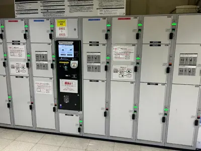 a bunch of machines lined up next to each other at Ueno Iriya Hotel in Tokyo
