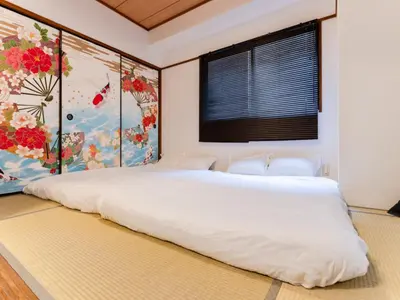 a bedroom with a large white bed with a window at Shinjuku,Ushigome Yanagicho Sta 1min walk , Kabukicho3min in Tokyo