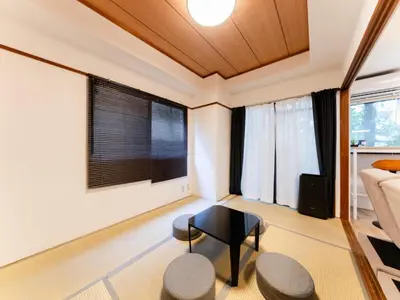 a living room with a couch and a table at Shinjuku,Ushigome Yanagicho Sta 1min walk , Kabukicho3min in Tokyo