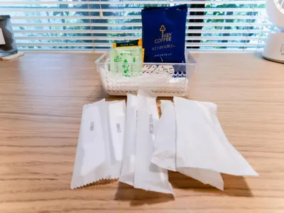 a group of white napkins and a basket on a table at Shinjuku,Ushigome Yanagicho Sta 1min walk , Kabukicho3min in Tokyo