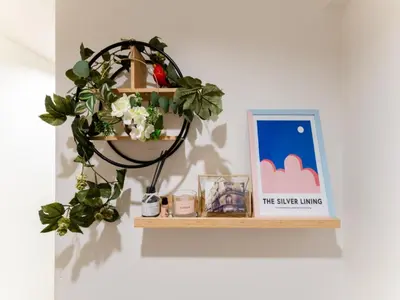 a shelf with a plant and a sign on a wall at Shinjuku,Ushigome Yanagicho Sta 1min walk , Kabukicho3min in Tokyo