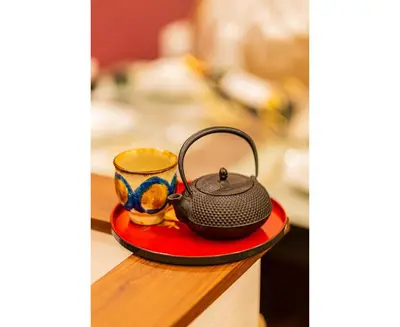 a tea pot and a cup on a table at \u65ed \u30cf\u30a6\u30b9\u3000asahi house in Tokyo