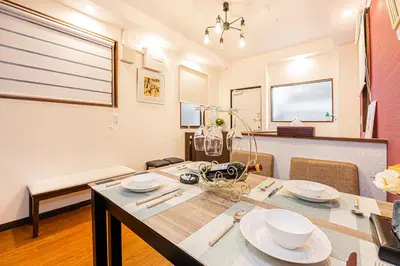 a dining room with a table and chairs and a room with a window at \u65ed \u30cf\u30a6\u30b9\u3000asahi house in Tokyo