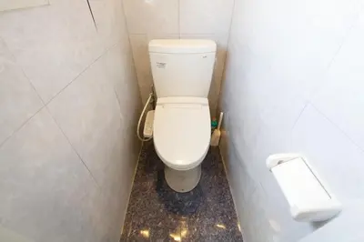a bathroom with a white toilet in a stall at smart room tokyo koiwa city in Tokyo