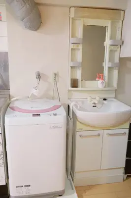 a small bathroom with a sink and a mirror at Ueno Hotel Palazetto Iriya in Tokyo