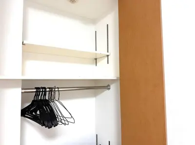 a bunch of black utensils on a shelf in a kitchen at Shin-Okubo Sta・1 min walk/　Shinjuku sta 2min/　Switch in Tokyo