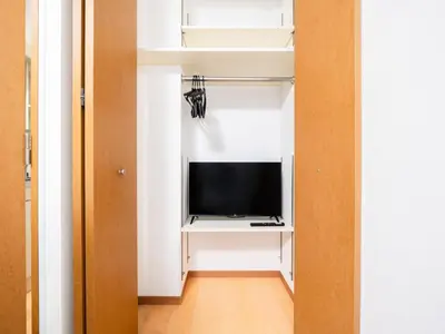 a room with a tv in a white closet at Shin-Okubo Sta・1 min walk/　Shinjuku sta 2min/　Switch in Tokyo