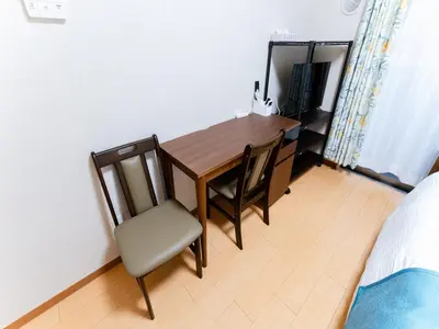 a dining room table and chairs in a room at Shinjuku/Shin-Okubo Sta 2min walk/Kabukicho 5 min in Tokyo