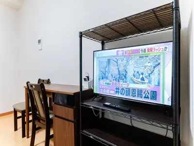 a flat screen tv sitting on top of a shelf at Shinjuku/Shin-Okubo Sta 2min walk/Kabukicho 5 min in Tokyo