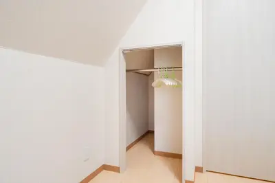 a hallway with a white wall and a light fixture at Shinjuku/Shin-Okubo Sta 2min walk/Kabukicho 5 min in Tokyo