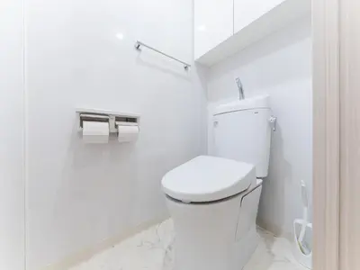 a white bathroom with a toilet and two rolls of toilet paper at Shinjuku/Shin-Okubo Sta 2min walk/Kabukicho 5 min in Tokyo