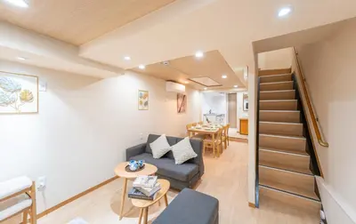 a living room with a couch and a table at New open \u548c\u98a8\u4f4f\u5b85 \u6771\u4e2d\u91ce\u99c5 \u5927\u4e45\u4fdd\u99c5\u5f92\u6b69\u5708\u5185 \u65b0\u5bbf\u99c5\u307e\u3067\u96fb\u8eca5\u5206\u6e0b\u8c37\u9280\u5ea7\u6771\u4eac\u8fd1\u3044 \u8377\u7269\u9810\u304b\u308a\u307e\u3059 in Tokyo