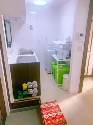 a kitchen with a sink and a counter with colorful balls at miki I in Tokyo
